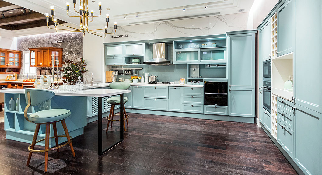 light blue shaker kitchen cabinets with white countertop