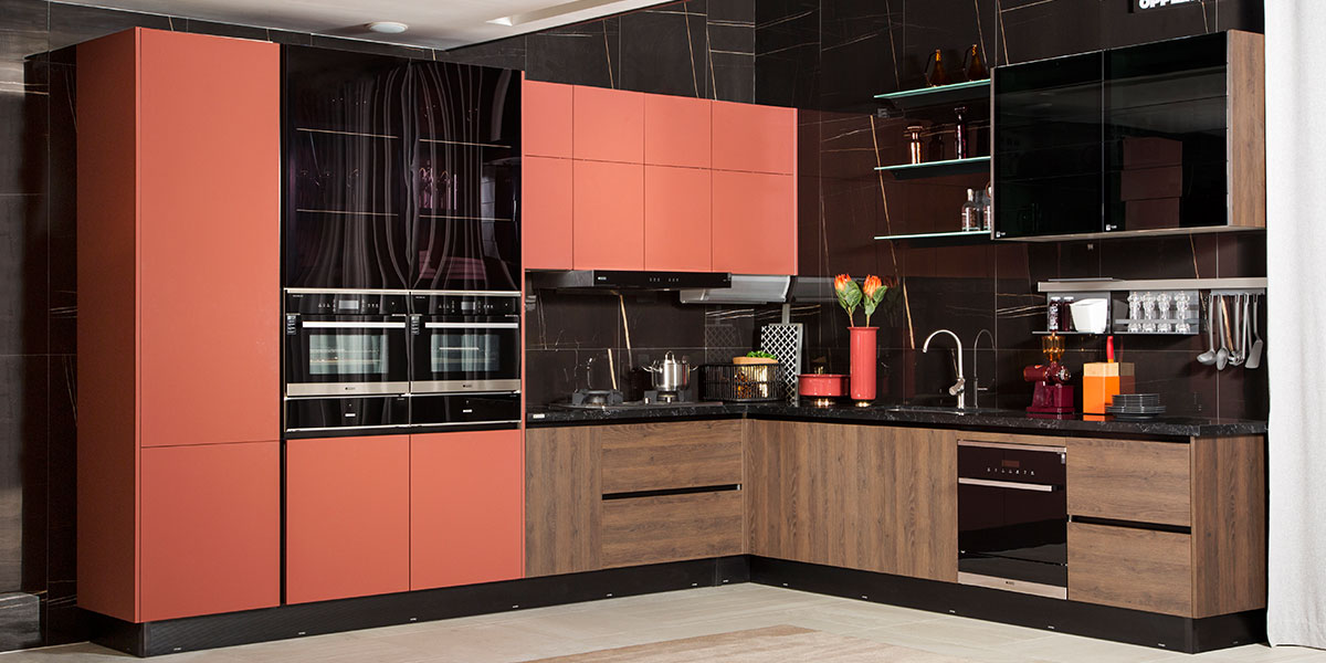modern L-shaped red and wood tone kitchen cabinets